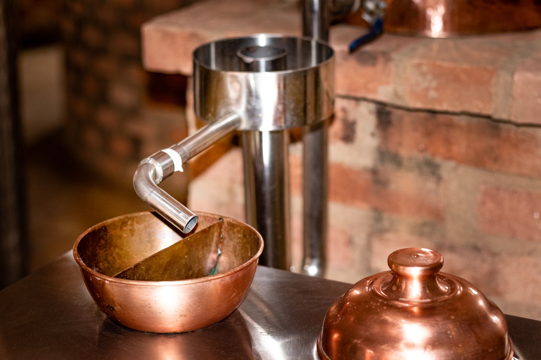 Copper distillation equipment in warm light